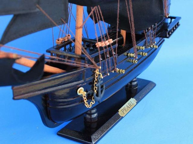   and rigging taut Sturdy wooden base with metal nameplate